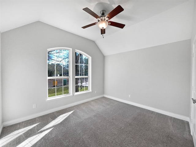 additional living space with carpet, ceiling fan, and vaulted ceiling