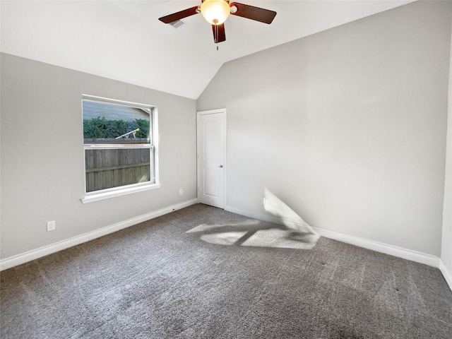 unfurnished room featuring ceiling fan, carpet floors, and vaulted ceiling