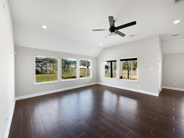 unfurnished living room featuring ceiling fan, a healthy amount of sunlight, and lofted ceiling