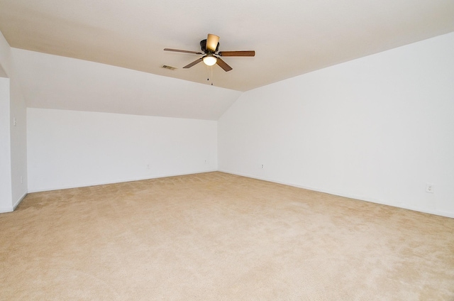 additional living space featuring carpet floors, ceiling fan, and lofted ceiling