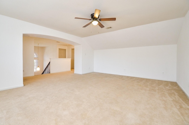 unfurnished room featuring carpet floors, ceiling fan, and lofted ceiling