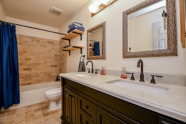 full bathroom featuring shower / tub combo, vanity, and toilet