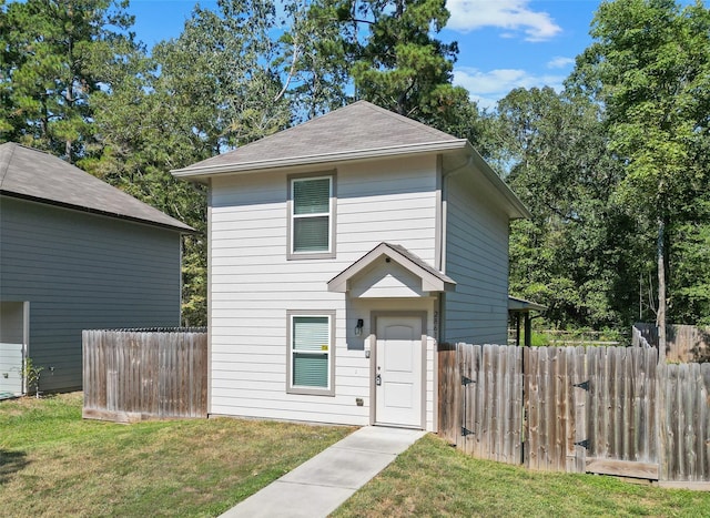 view of property featuring a front yard