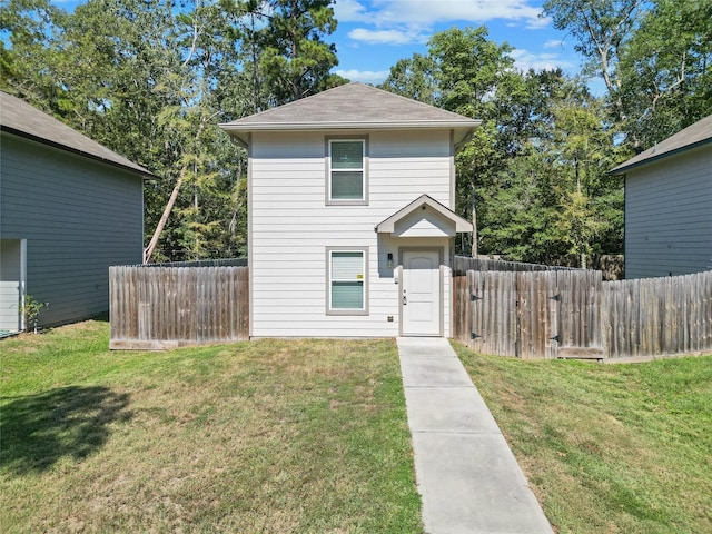 view of property featuring a front yard