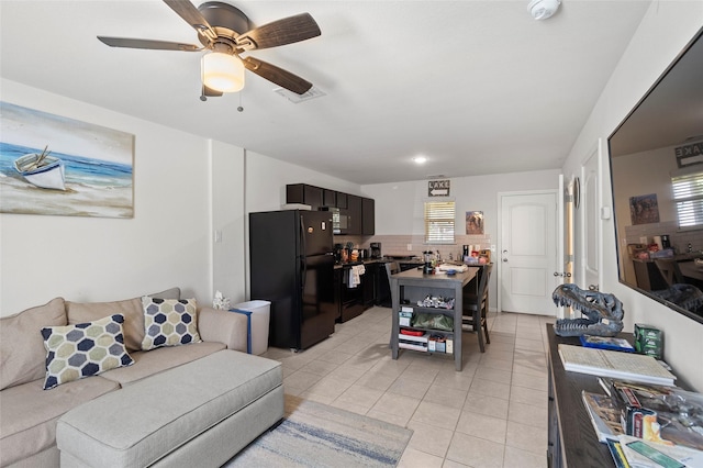 living room with ceiling fan, a healthy amount of sunlight, and light tile patterned flooring