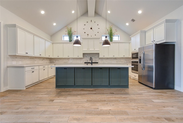 kitchen with white cabinets, stainless steel appliances, high vaulted ceiling, and hanging light fixtures