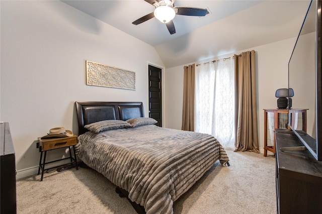 carpeted bedroom featuring ceiling fan and lofted ceiling