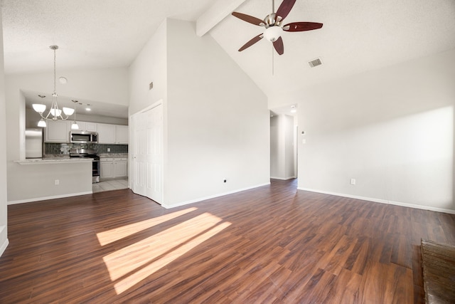 unfurnished living room with beam ceiling, ceiling fan with notable chandelier, high vaulted ceiling, and dark wood-type flooring