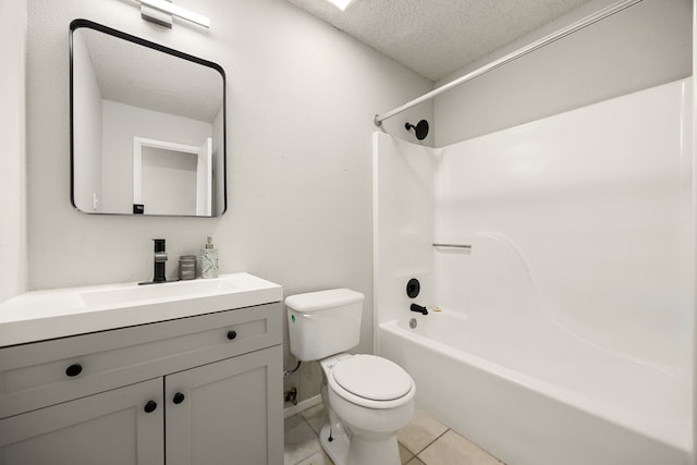 full bathroom with tile patterned flooring, a textured ceiling, toilet, shower / washtub combination, and vanity