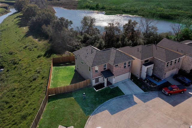 birds eye view of property featuring a water view