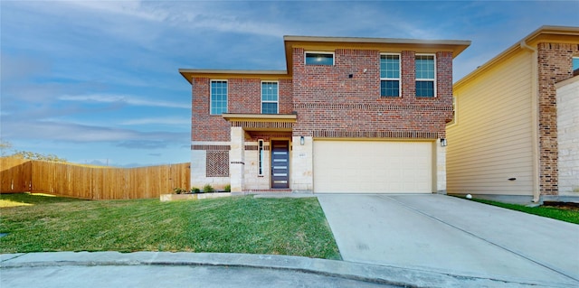 view of front of property featuring a front yard and a garage