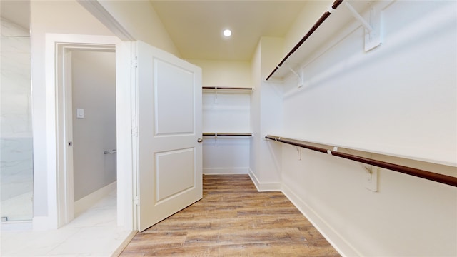 spacious closet with light wood-type flooring