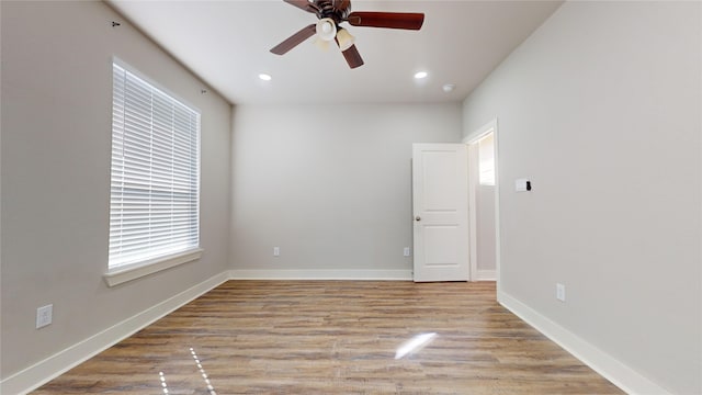 unfurnished room with ceiling fan and light hardwood / wood-style flooring