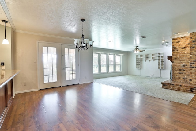 unfurnished living room featuring wood-type flooring, ceiling fan with notable chandelier, a textured ceiling, and crown molding