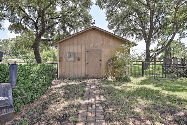 view of outbuilding with a lawn