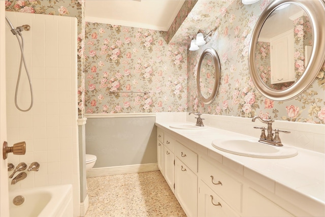 full bathroom featuring vanity, toilet, ornamental molding, and tiled shower / bath