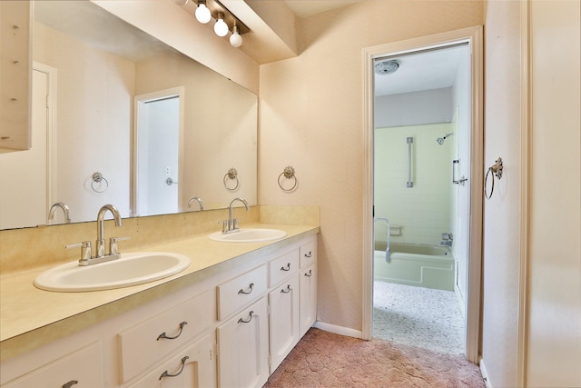 bathroom featuring vanity and washtub / shower combination