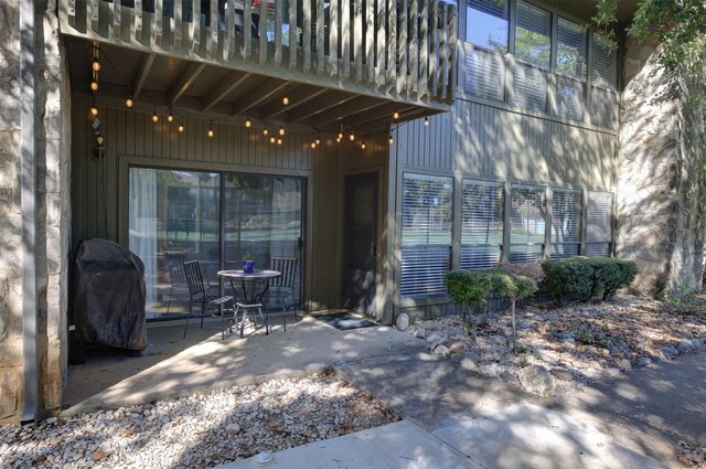 entrance to property featuring a patio