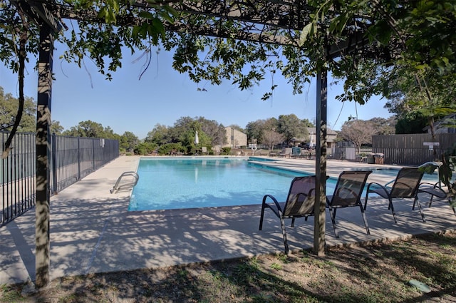 view of swimming pool featuring a patio area