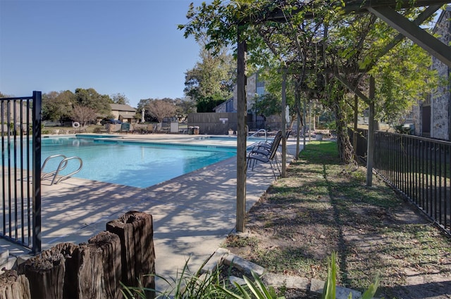 view of swimming pool featuring a patio