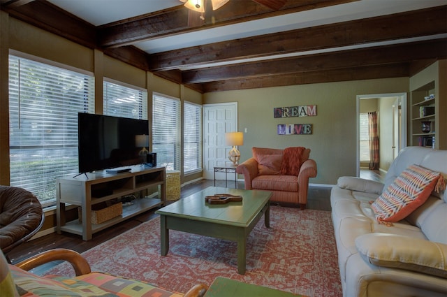 living room with beamed ceiling, hardwood / wood-style flooring, built in features, and ceiling fan