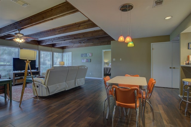 dining space featuring beamed ceiling, dark hardwood / wood-style floors, and ceiling fan