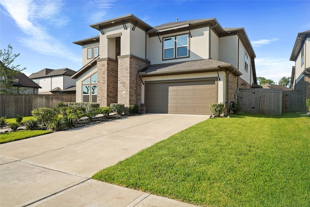 view of front of property featuring a front lawn and a garage