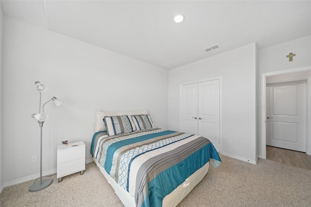 carpeted bedroom featuring a closet