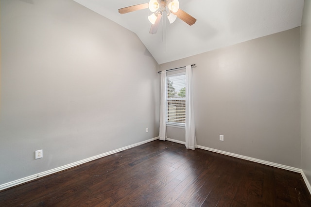 empty room with dark hardwood / wood-style floors, ceiling fan, and lofted ceiling