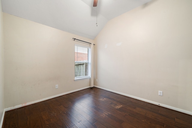 spare room featuring dark hardwood / wood-style floors, ceiling fan, and lofted ceiling