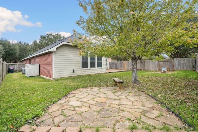 rear view of property with a lawn and a patio area