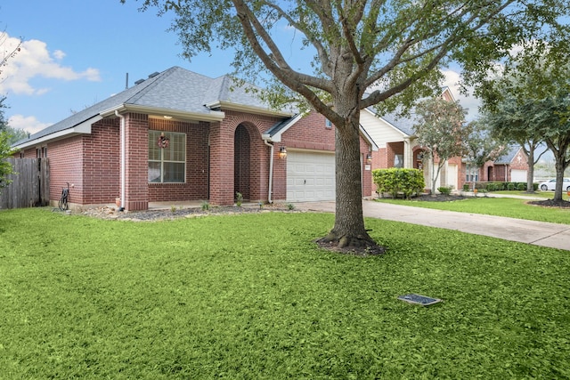 single story home with a front yard and a garage