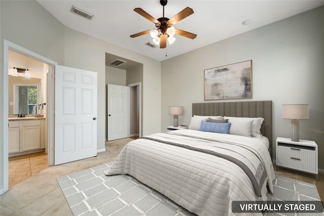 carpeted bedroom with ceiling fan, sink, and connected bathroom