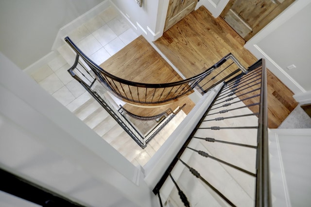 staircase with tile patterned floors