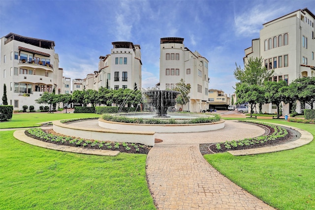 view of property's community featuring a yard