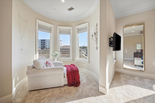 living area with light colored carpet and ornamental molding