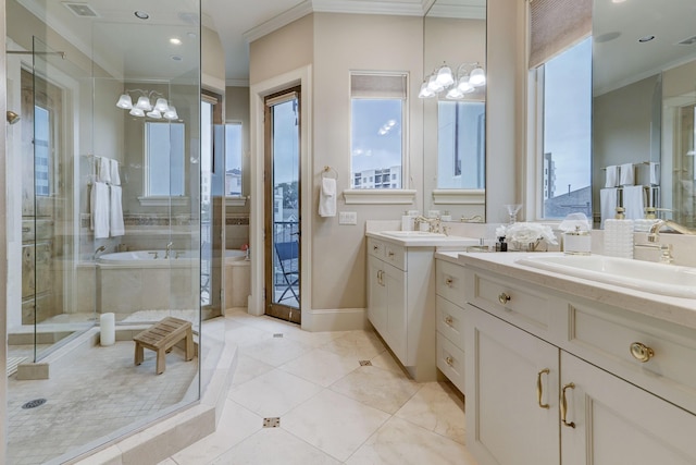 bathroom with tile patterned flooring, vanity, separate shower and tub, and a wealth of natural light