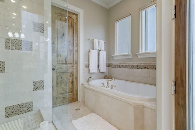 bathroom featuring tile patterned flooring, ornamental molding, and independent shower and bath