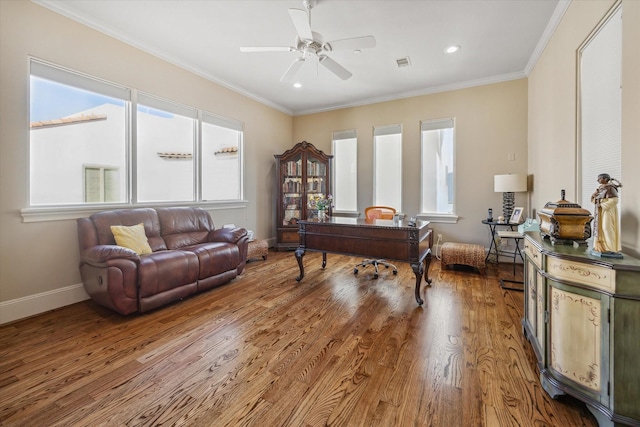 office area with ceiling fan, wood-type flooring, and ornamental molding