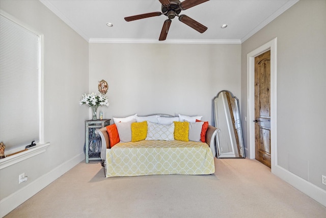 bedroom with ceiling fan, ornamental molding, and light carpet