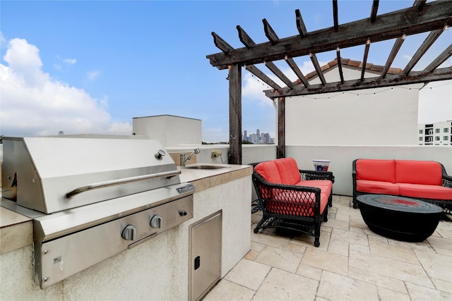 view of patio / terrace featuring sink, an outdoor kitchen, a pergola, an outdoor living space, and grilling area