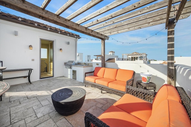 view of patio with a pergola, area for grilling, an outdoor kitchen, and an outdoor hangout area