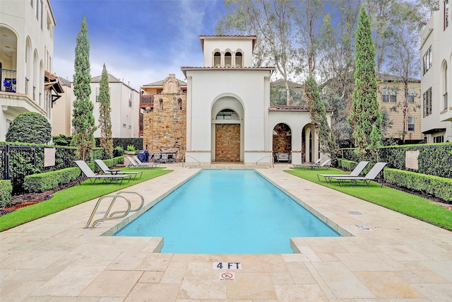 view of pool featuring a patio