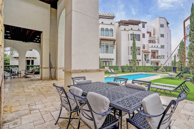 view of patio featuring a community pool