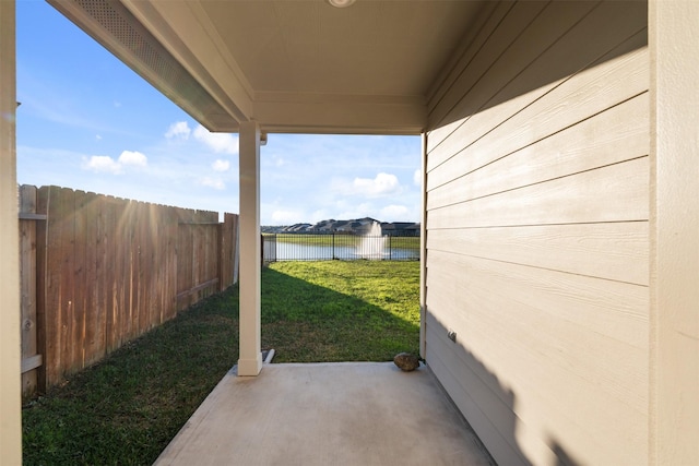 view of patio / terrace with a water view