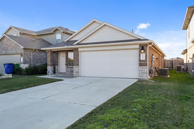 view of front of home with cooling unit, a garage, and a front yard