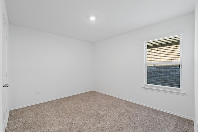 view of carpeted spare room