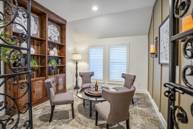 living area featuring vaulted ceiling