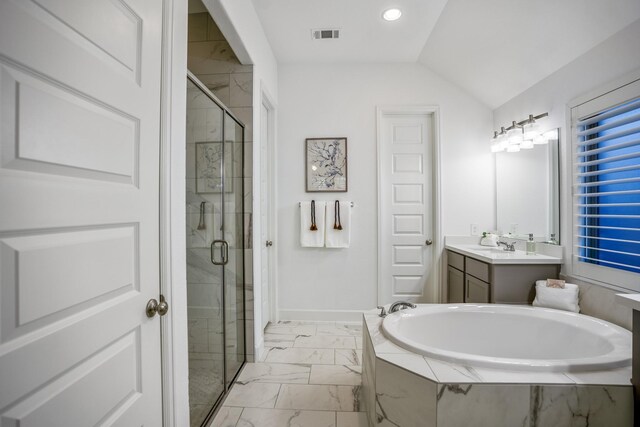 bathroom with separate shower and tub, vanity, and lofted ceiling