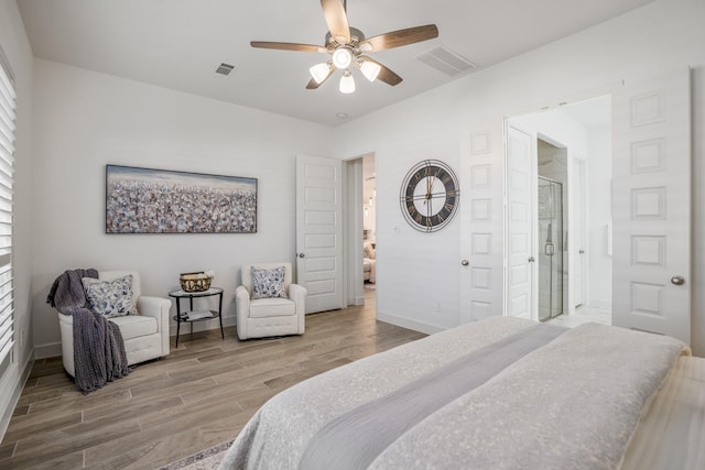 bedroom with ceiling fan, wood-type flooring, and ensuite bathroom